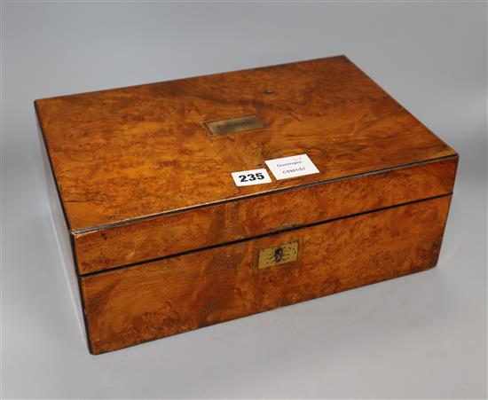 A burr walnut writing slope, with leather slope, inlaid plaque for C. Roberts